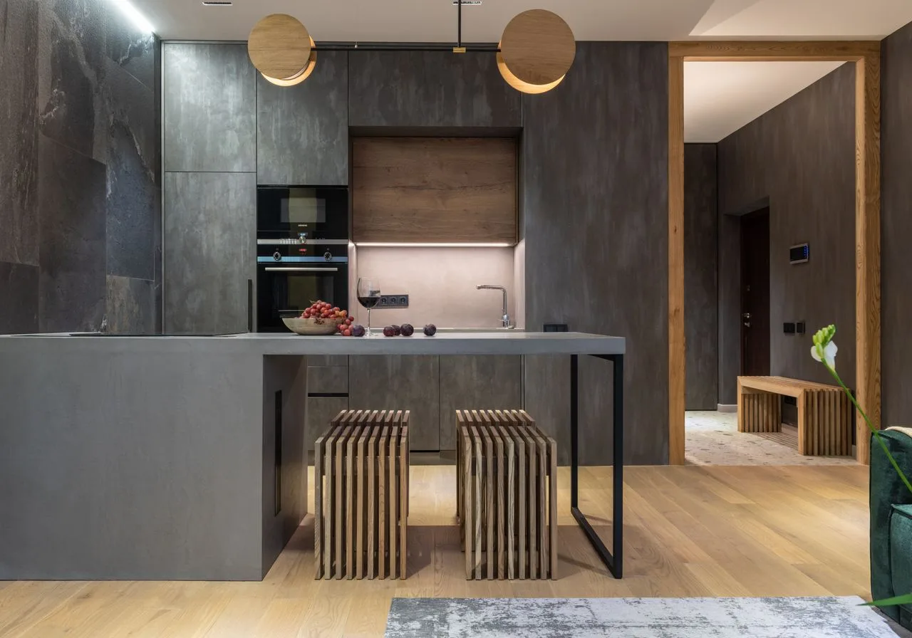 Minimalist kitchen with dark flat-panel cabinets and soft lighting