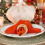 Fall table with pumpkin decor in warm candlelight